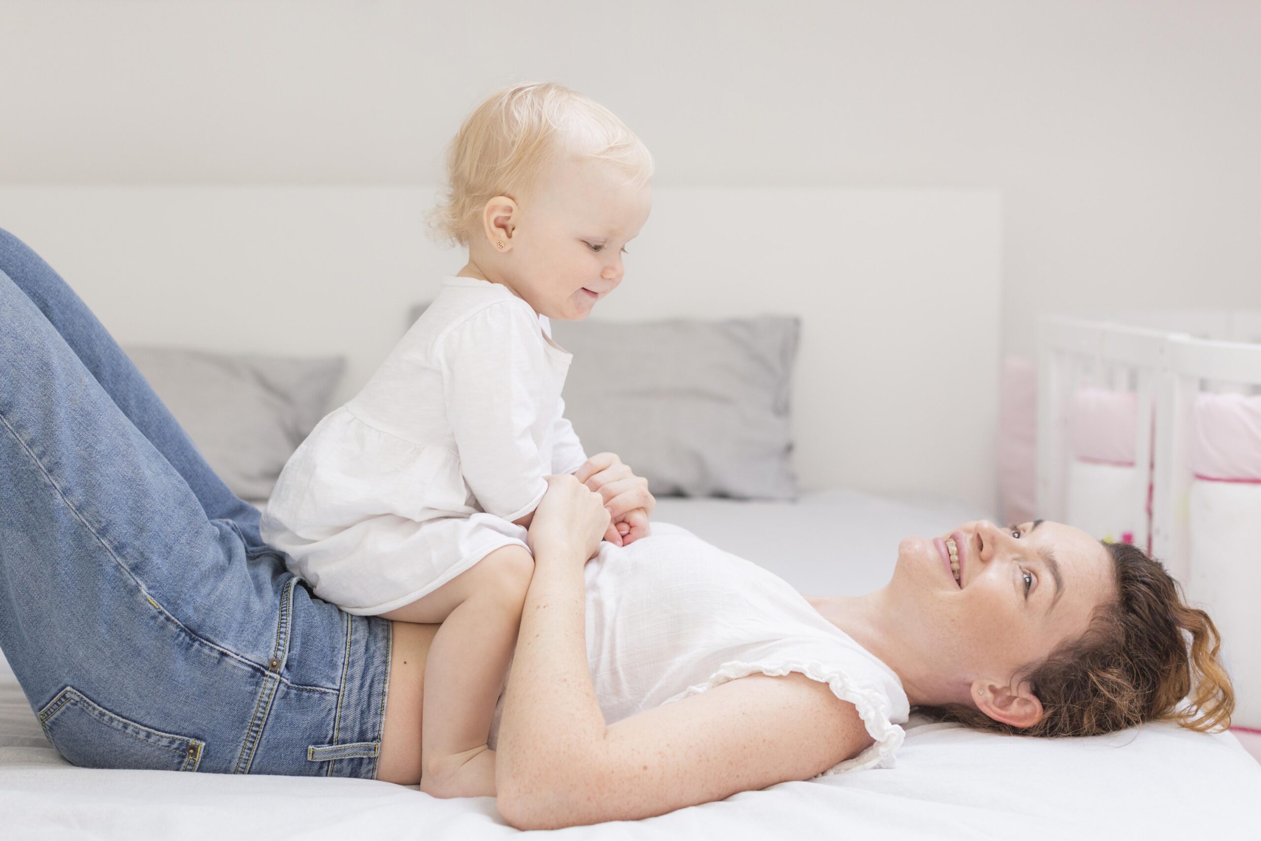 beautiful-mother-playing-with-cute-baby-girl